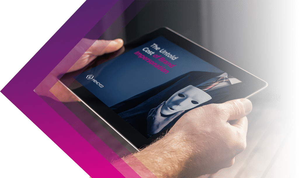 A person holds a tablet displaying an image of a suited figure with a white mask, highlighting the untold cost of brand impersonation and emphasizing the risks businesses face from this growing threat.