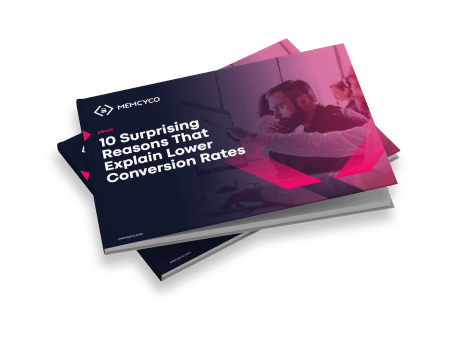 A single E-book titled "10 Surprising Reasons That Explain Lower Conversion Rates" by Memcyco is shown on top of another booklet against a white background.