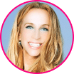 Portrait of a smiling woman with long blonde hair, light blue eyes, and a blue background, framed by a pink circular border—embodying confidence in cybersecurity and fraud prevention.