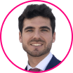 Headshot of a man with dark hair and facial hair wearing a suit and tie, shown inside a pink circular border on a white background, reflecting professionalism in the digital era.