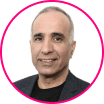 Portrait of a middle-aged man with short gray hair, wearing a dark blazer and black shirt, pictured against a white background with a pink circular border—ideal for discussing account takeover fraud and cybersecurity.