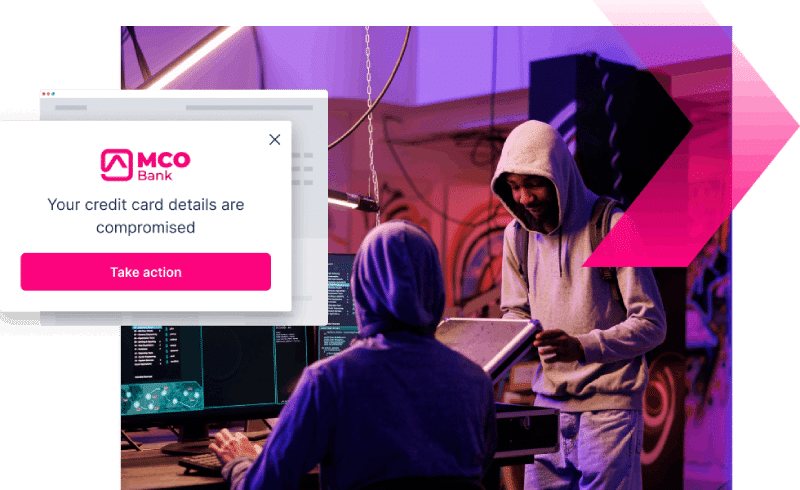 Two people in hoodies work at computers in a dark room; a pop-up alert warns, "Your credit card details are compromised" from MCO Bank, highlighting the dangers of credit card scams.