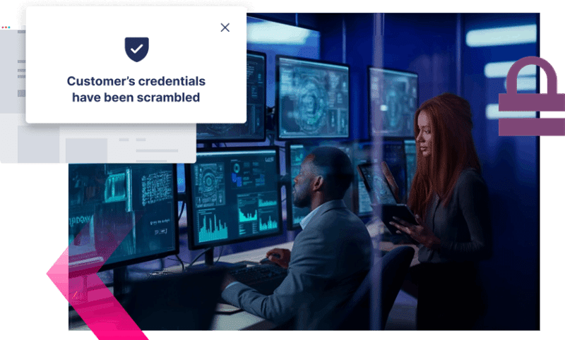 Two people work at computer monitors displaying cybersecurity data; a message on screen reads, "Customer’s credentials have been scrambled," highlighting the importance of Digital Impersonation protection.