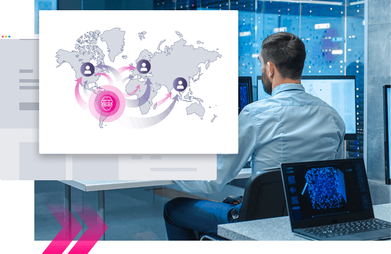 A man in an office with computer screens examines a world map infographic, highlighting global network connections between users—a potential SEO poisoning use case.